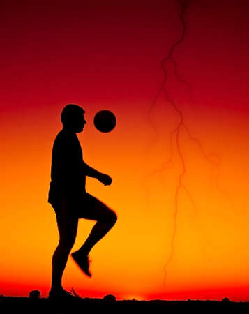 football at sunsetの写真素材
