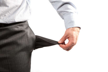 Disappointed businessman with empty pockets isolated over white の写真素材