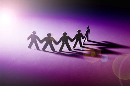 Group of male paper chain representing teamwork.の写真素材