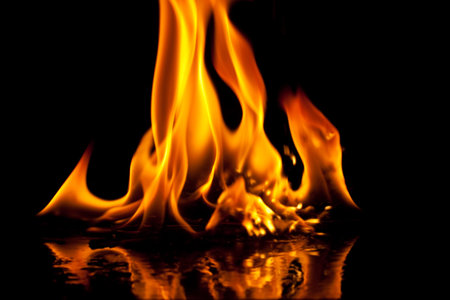 Close-up of fire and flames on a black backgroundの写真素材