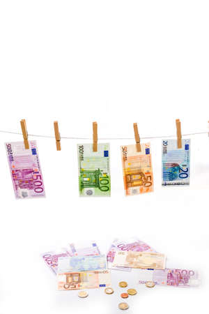 Euro money laundering on clothesline isolated on white backgroundの写真素材