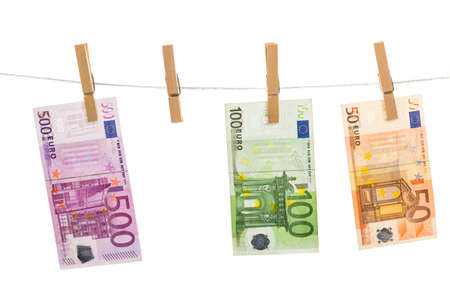 Euro money laundering on clothesline isolated on white backgroundの写真素材