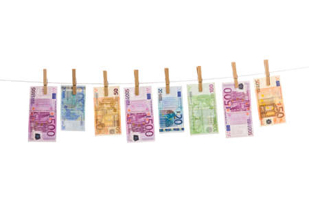 Euro money laundering on clothesline isolated on white backgroundの写真素材