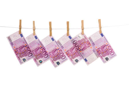 Euro money laundering on clothesline isolated on white backgroundの写真素材