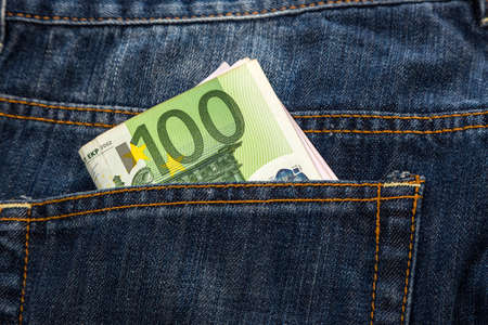 Euro banknotes in jeans back pocketの写真素材