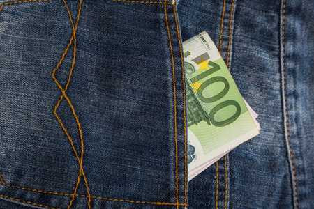 Euro banknotes in jeans back pocketの写真素材