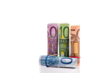 Rolled up Euro bills isolated の写真素材