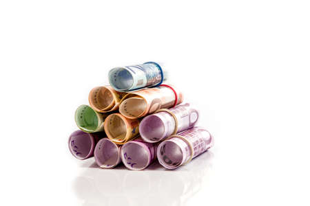 Rolled up Euro bills isolated の写真素材