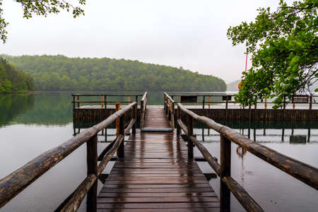 Rainy day. Pier at plitvicka jezera national park, Croatiaの写真素材