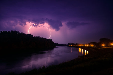 clouds and thunder lightnings and storm in river Tisza. Hungary