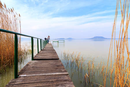 Wooden pier in tranquil lake Balaton-Hungaryの写真素材