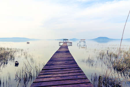 Wooden pier in tranquil lake Balaton-Hungaryの写真素材