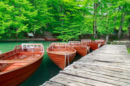 Boats in Plitvice lakes and pier in Plitvice national park, croatiaの写真素材