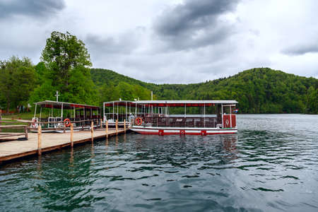 Ferry boats on Plitvice lakes pier in Plitvice national park, Croatiaの写真素材