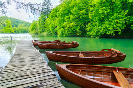 Boats in Plitvice lakes and pier in Plitvice national park, Croatia.の写真素材