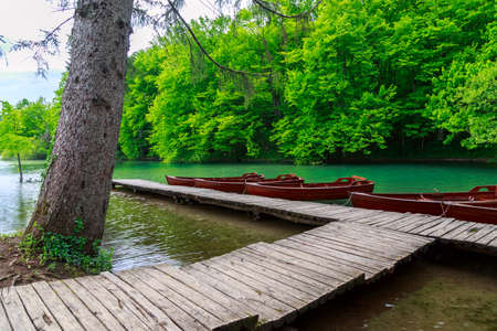 Boats in Plitvice lakes and pier, Croatia. Plitvice national parkの写真素材