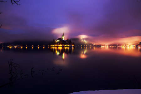 Foggy dusk in Bled lake in Sloveniaの写真素材
