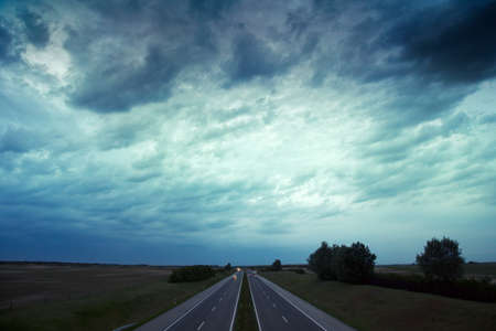 Hungarian highway in stormy day in meadowの写真素材
