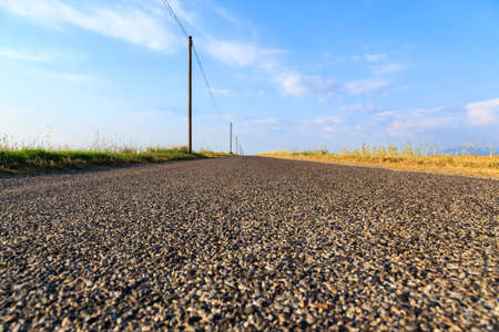 Country road through farmland near Valensole, Provence-Franceの写真素材