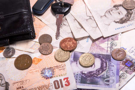 Pound money and black wallet backgroundの写真素材