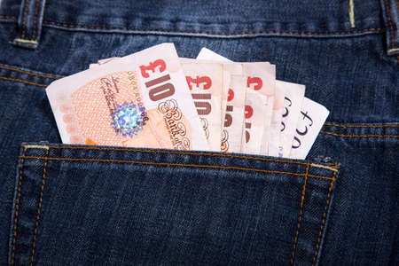 Sterling currency money in the pocket of jeansの写真素材