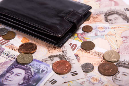Pound money and black wallet backgroundの写真素材