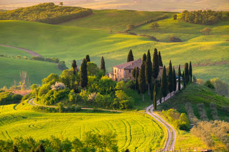 Tuscany landscape, typical for the region tuscan farm house, hills.Italyのeditorial素材