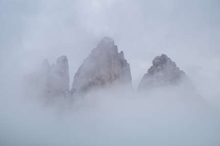 Snowy day, overcast skies on the Drei Zinnen Lavaredo, Dolomites Alps mountains, Italyの写真素材