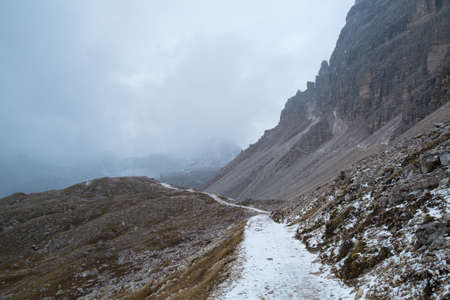 Snowy day, overcast skies on the Drei Zinnen Lavaredo, Dolomites Alps mountains, Italyの写真素材