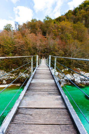 Old wooden bridge over Soca river, Sloveniaの写真素材