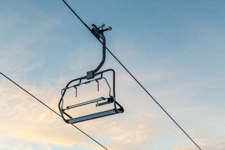 Ski lift chairs and blue sky near Vogel ski center-Sloveniaの写真素材