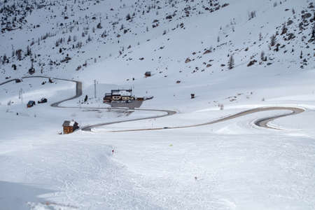 Snowy mountain road in winter landscape near Passo Giau in Dolomites mountain in Italy.の写真素材