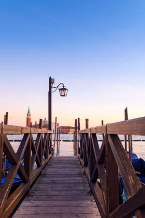 Venice pier and a background  can see the chucrh of San Giorgio Maggioreの写真素材