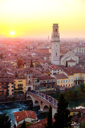 View of Verona city with Ponte Pietra and the river Adige at sunset.Italy.の写真素材
