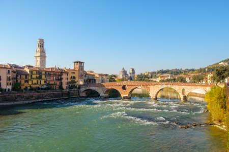 Ponte Pietra bridge on Adige river sunny day in  Verona, Italy.の写真素材