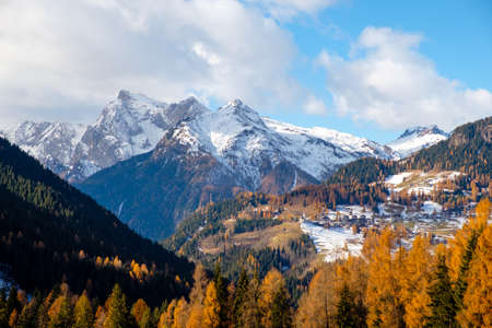 Mountainous landscape with villages of Colle Santa Lucia at the Dolomites in Italyの写真素材