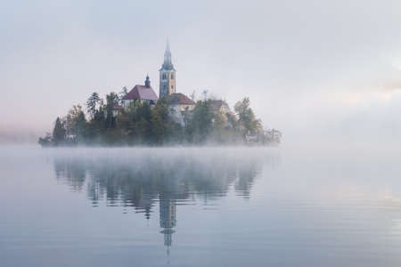 Lake Bled with the church on a calm autumn morningの写真素材