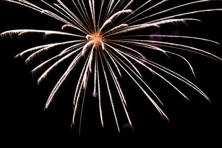 Festive celebration firework lights in the dark night skyの写真素材