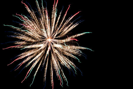 Festive celebration firework lights in the dark night skyの写真素材