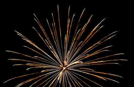 Festive celebration firework lights in the dark night skyの写真素材