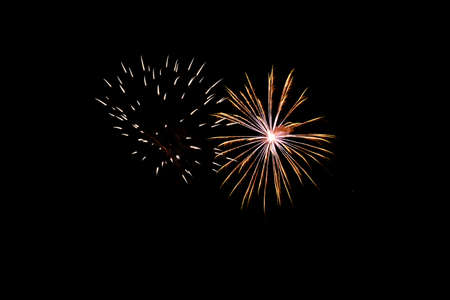 Festive celebration firework lights in the dark night skyの写真素材