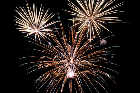 Festive celebration firework lights in the dark night skyの写真素材