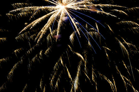 Festive celebration firework lights in the dark night skyの写真素材