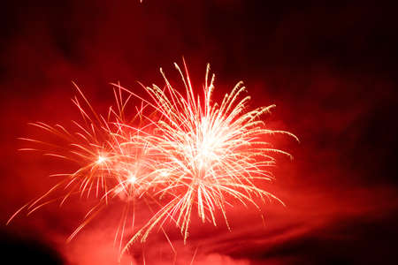 Festive celebration firework lights in the dark night skyの写真素材
