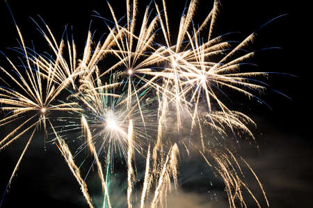 Festive celebration firework lights in the dark night skyの写真素材