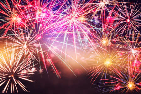 Festive celebration firework lights in the dark night skyの写真素材