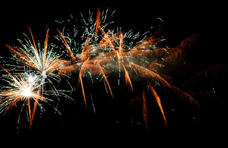 Festive celebration firework lights in the dark night skyの写真素材