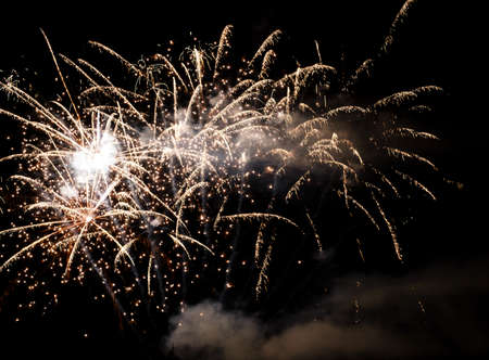 Festive celebration firework lights in the dark night skyの写真素材