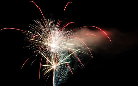 Festive celebration firework lights in the dark night skyの写真素材