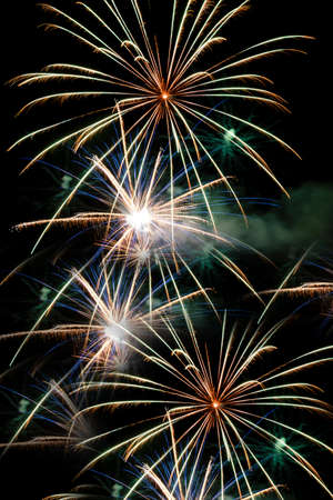Festive celebration firework lights in the dark night skyの写真素材